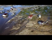 إخلاء جوي لأشخاص عالقين في أسطح منازل جراء الفيضانات بالبرازيل