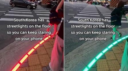 شاهد.. كوريا الجنوبية تكافح حوادث مدمني الهواتف بإشارات مرورية على الأرض